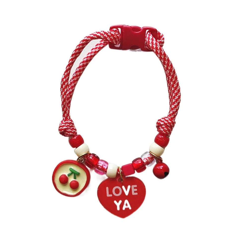Colorful braided pet collar with a red bell for cats and small dogs