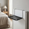 A white breathable mesh cat window hammock is mounted on a wall, shown next to a bed.