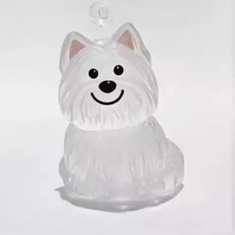A clear, sculpted dog head charm with upright ears and a smiling expression, suspended by a loop.