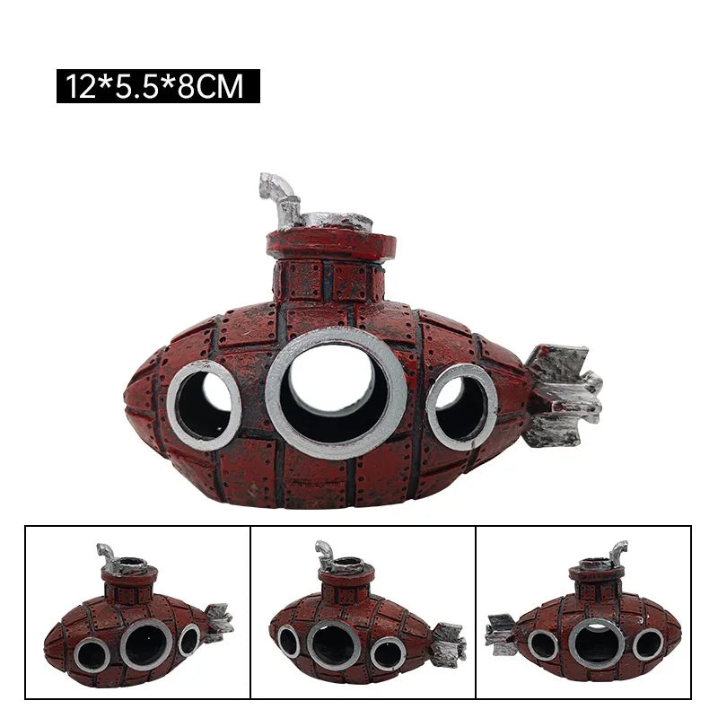 A detailed resin submarine ornament painted red and silver, featuring a round hull and propeller.