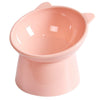 A pink ergonomic tilted cat food bowl with a non-slip base.