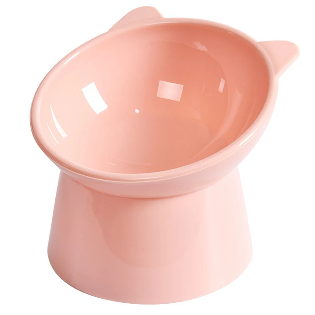 A pink ergonomic tilted cat food bowl with a non-slip base.