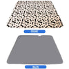 Two views of a reusable dog pee pad, showing the patterned front and solid gray back.