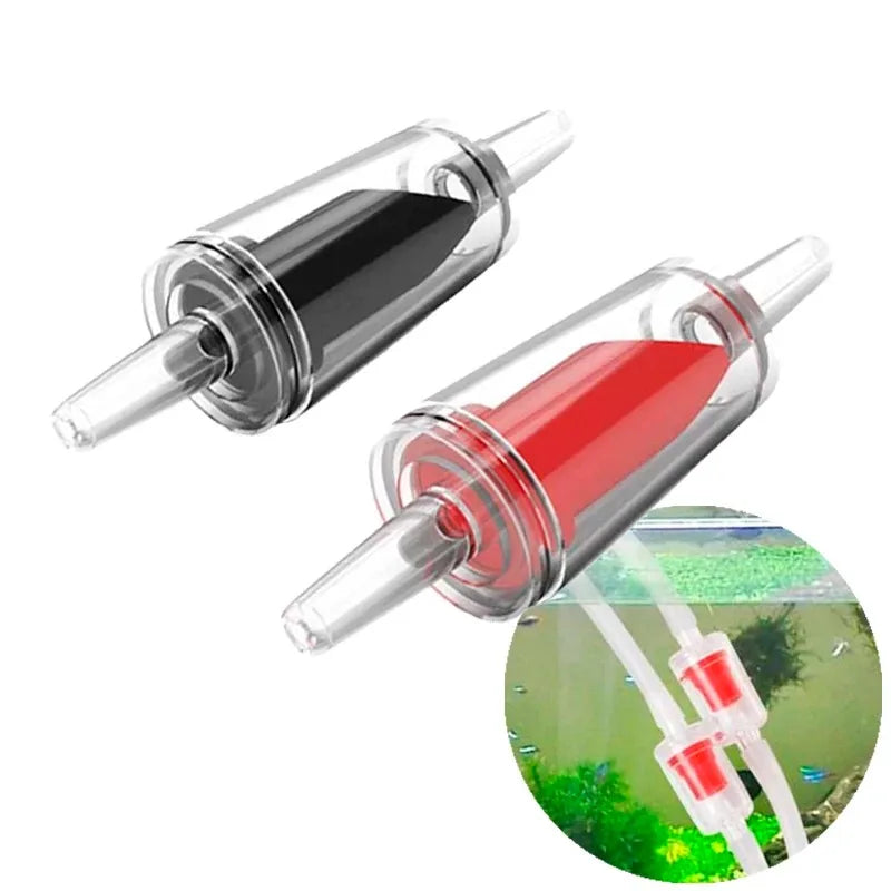 A set of aquarium air pump check valves in clear plastic tubes with black and red fluid visible.