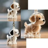 Un ensemble de porte-clés pour poils d'animaux mignons avec des figurines de chiens blancs et brun clair.