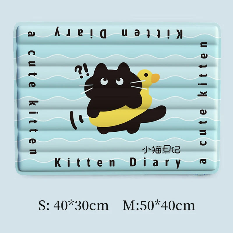 A rectangular kitten diary mat featuring a cute black and yellow cat illustration on a light blue background.