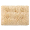 A square, light beige plush pet bed mat with a fluffy texture and non-slip base.