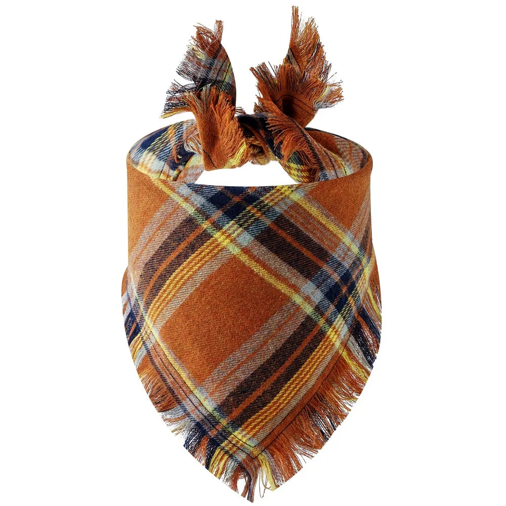 A square buffalo plaid bandana in shades of brown, orange, and navy with fringed edges.