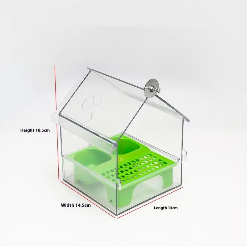 Clear plastic parrot feeder and bird bath accessory with a green tray and a mounting plate.