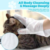 A white cleaning glove is massaging a cat's coat for deep cleansing and massage.