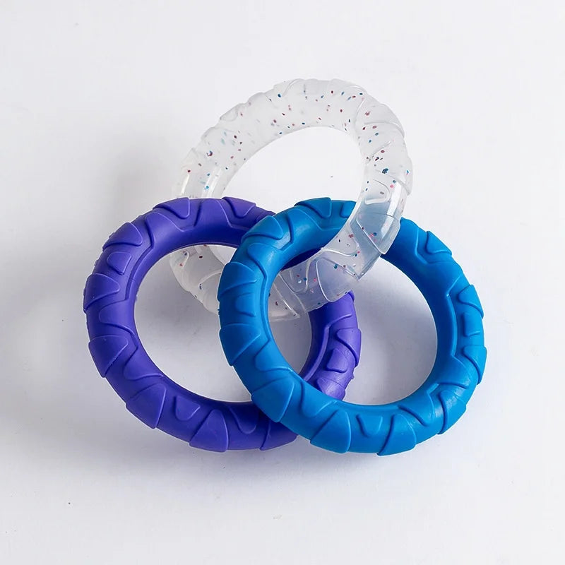 Three purple and blue TPR pull ring dog chew toys are stacked on a white background.