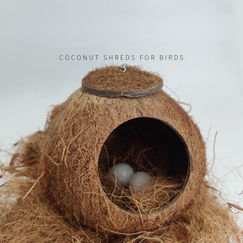 A round, woven coconut shred bed for birds resting in a light brown fiber.