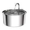 Stainless steel pet water fountain with a visible water stream flowing from the spout