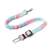 Pink and blue striped adjustable traction rope safety harness with a metal clip.
