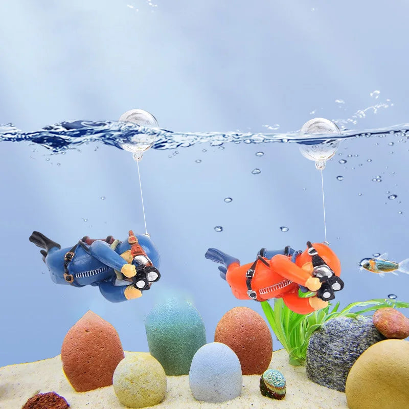 Miniature diver aquarium decoration with floating ball suspended underwater