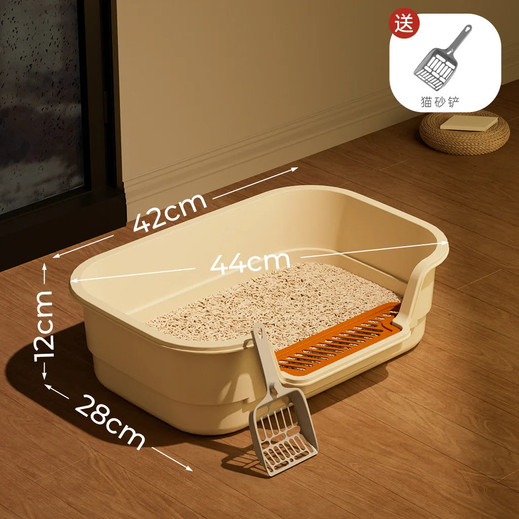 A large semi-enclosed cat litter box with an orange grate and a wooden frame is shown on a wooden floor.