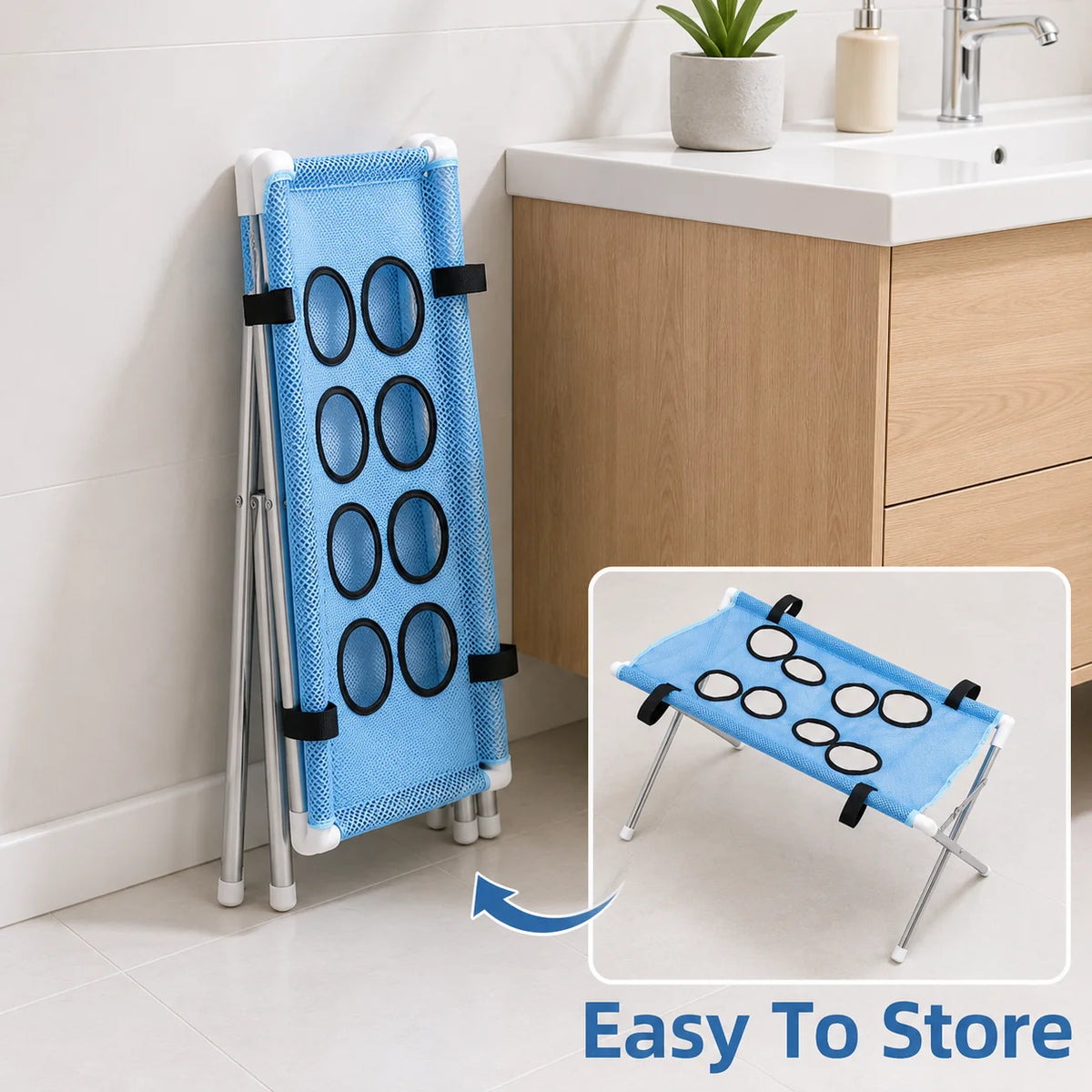 A blue foldable pet bath hammock stand with multiple circular openings is shown next to a kitchen cabinet.