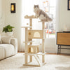 A multi-level cat tree with scratching posts and condos made of light wood, featuring a fluffy gray and white cat perched on 