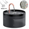 A black automatic pet water fountain with a copper-colored spout and sensor components shown nearby.