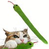 A green crinkle toy shaped like a cat is being played with by a domestic cat.