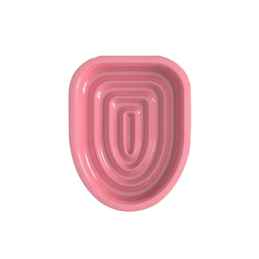 Cuenco reutilizable de plástico moldeado rosa para entrenamiento de orinal de gato con estrías concéntricas.