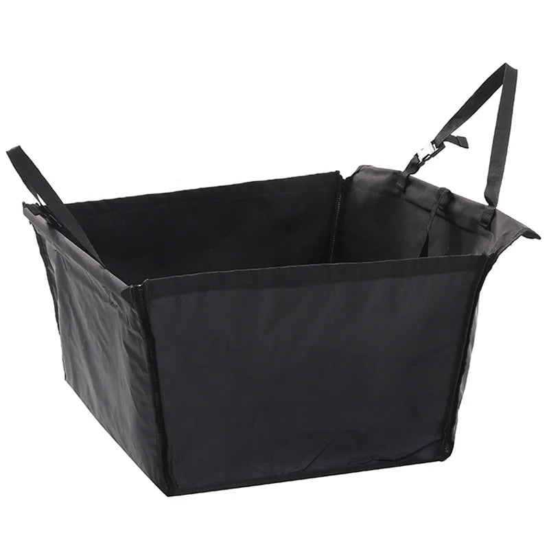 Black pet car seat hammock cover with a carrying strap.