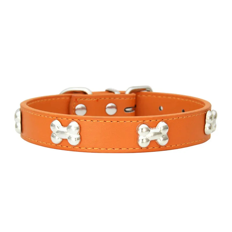 An orange leather dog collar with silver hardware and a woven pattern.
