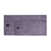 A rectangular, soft purple pet bath towel with paw prints embroidered on the surface.