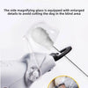 Close-up of a stainless steel pet nail clipper with an enlarged magnifying glass feature.