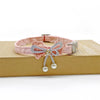 Pink lace flower cat collar with a pearl bell hanging from the adjustable soft necklace
