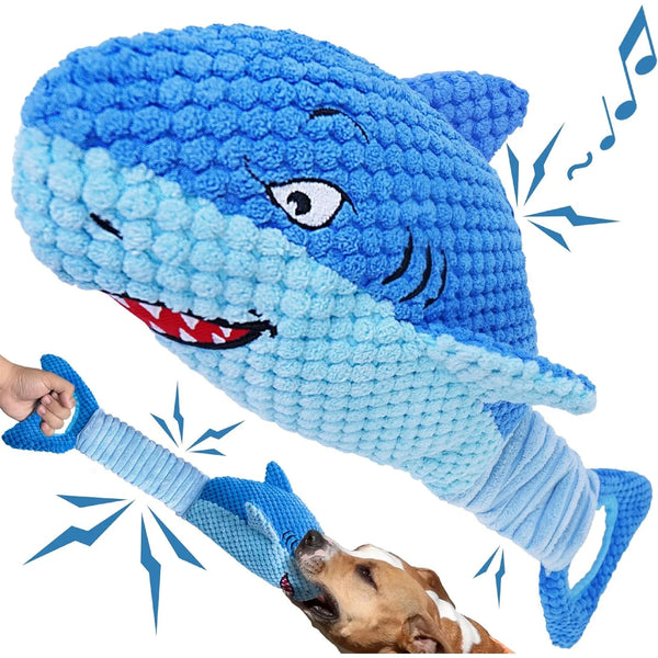 A blue plush shark toy is shown being interacted with by a dog, demonstrating its squeaker feature.