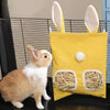A yellow fabric bag with a rabbit face design is shown next to a small brown and white rabbit.
