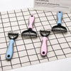 A collection of five stainless steel pet hair removal comb brushes for dogs and cats in various colors