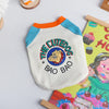 A white dog vest with blue trim and orange collar featuring a graphic of a cute dog face and the text THE CUTEDOG BAO BAO