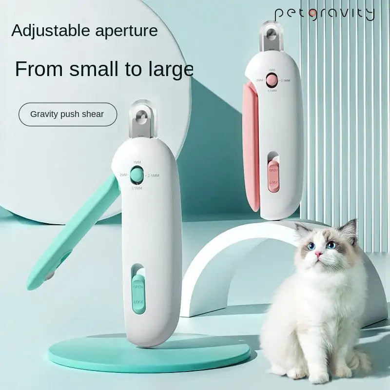A white gravity push shear pet nail clipper is shown next to a cat, demonstrating its adjustable aperture feature.
