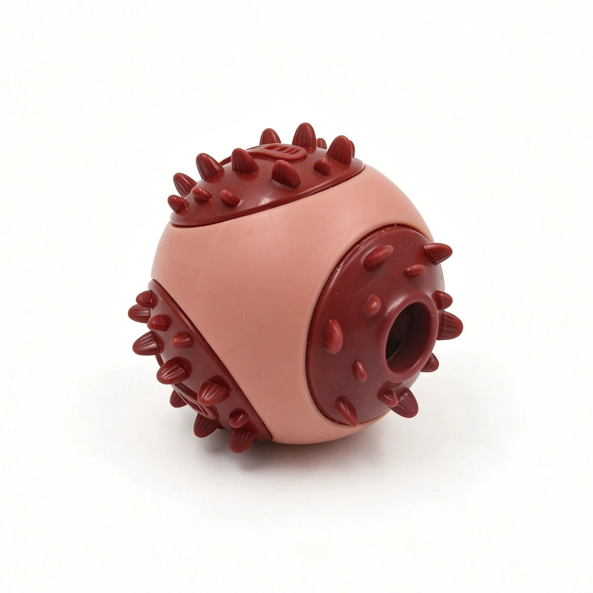 A pink and brown interactive bouncing fish treat dispenser for pets.
