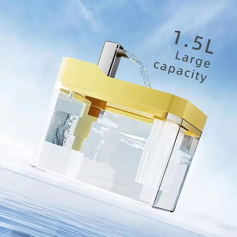 A clear glass and yellow automatic cat water fountain with a spout is shown against a light blue sky.