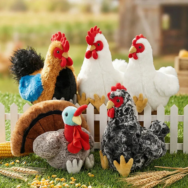 A set of lifelike plush rooster and hen toys with bright colors and textures displayed on green grass.