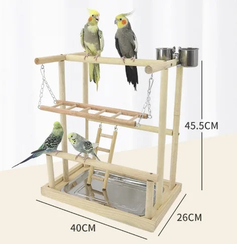 A wooden parrot climbing platform featuring a bridge and feeding stations for birds.