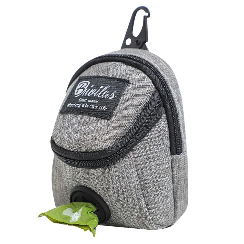 Sachetoche portable pour chien gris avec distributeur noir et feuille verte visible.