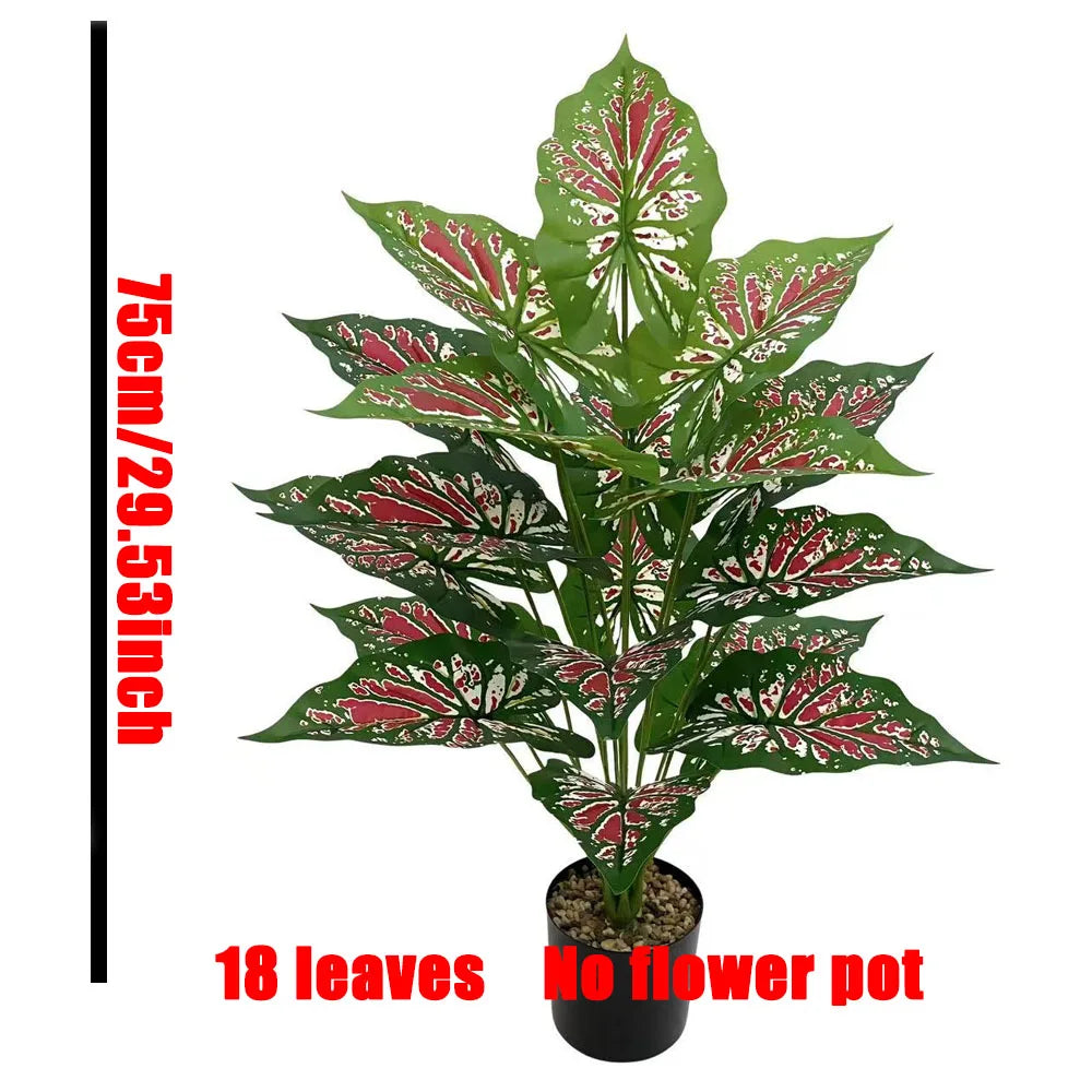 A bouquet of 18 artificial Monstera leaves in green and red patterns displayed in a black pot.