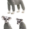 A small, gray dog wearing a thermal fleece jumpsuit for winter warmth.