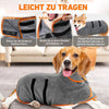 A dog wearing a gray and orange adjustable bathrobe, demonstrating how to put it on.