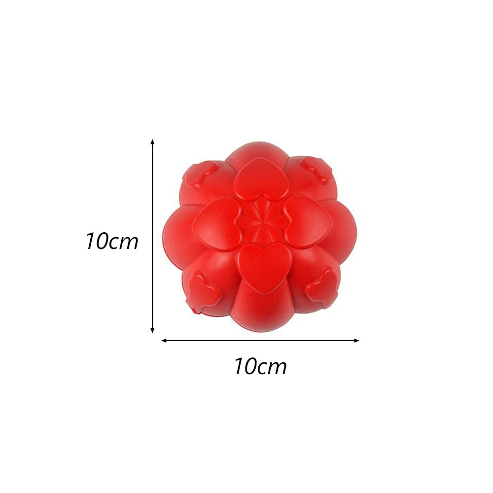 A bright red hexagonal TPR dog chew toy shaped like a flower, shown with dimensions of 10cm by 10cm.