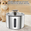 A stainless steel automatic pet water fountain is shown with water flowing, next to a cat.