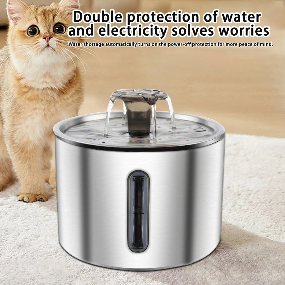 A stainless steel automatic pet water fountain is shown with water flowing, next to a cat.