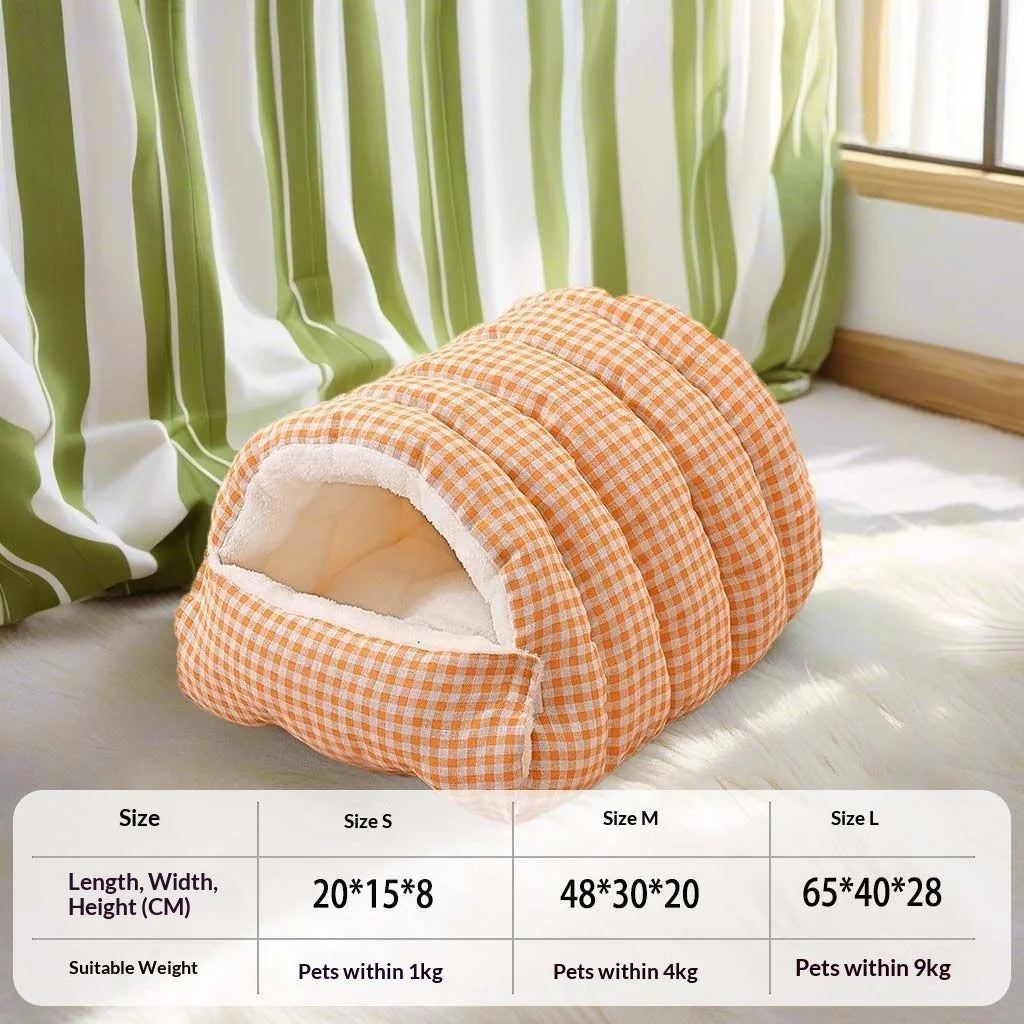 An orange checkered cat bed with a plush fleece lining and removable cover shown on a light surface.