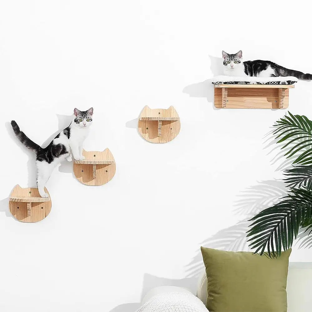 Wall-mounted wooden cat tree with a hammock and a cat resting on it.