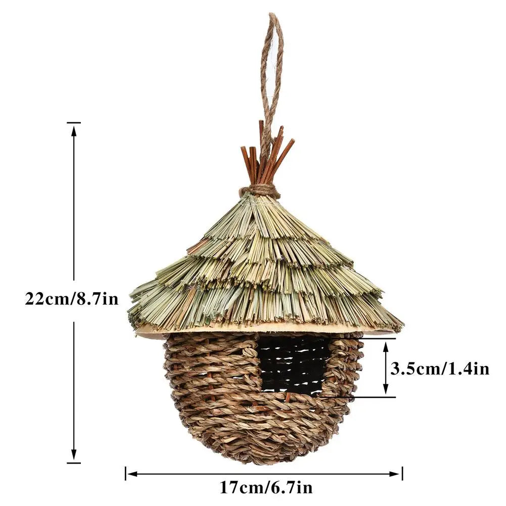 Handwoven straw bird nest for parrots with a conical roof and woven base