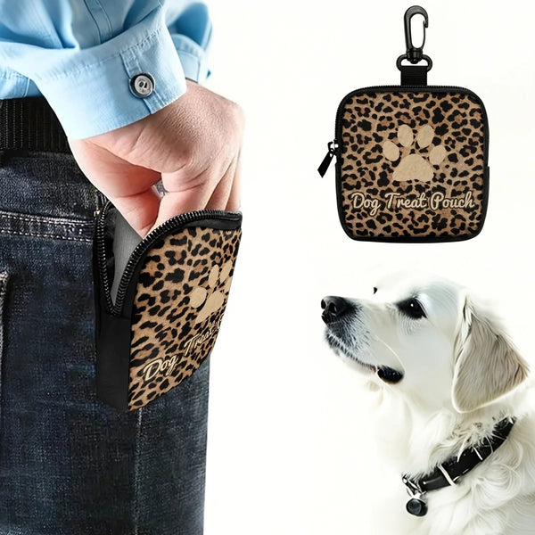A black leopard print leather dog treat pouch with a clip is shown next to a white dog.